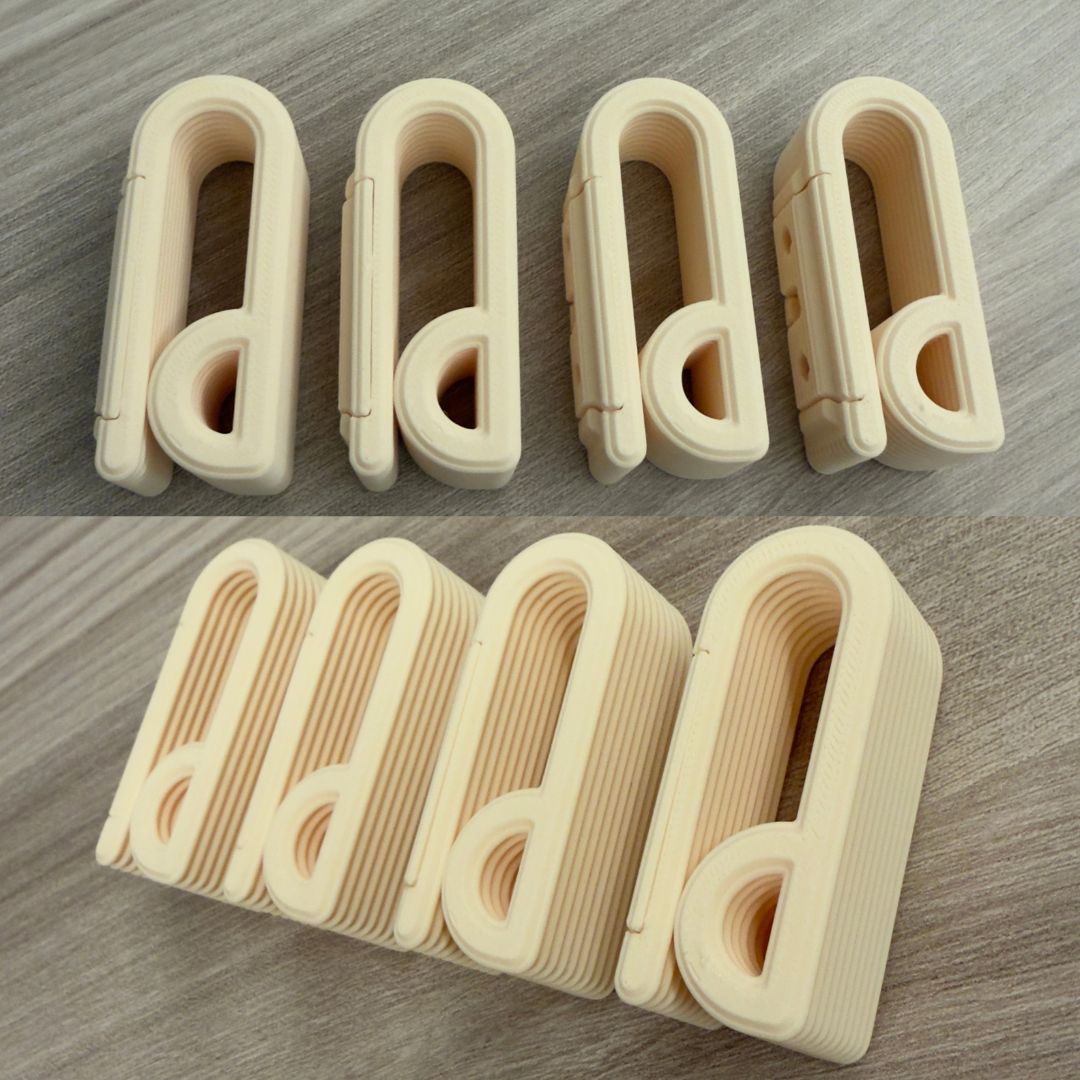 Ganci appendiabiti minimal 3D in design costine eleganti, nero opaco, per la casa, brand LEOTREDDI.
